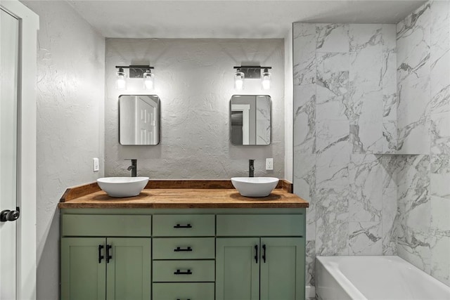 bathroom with vanity and a bathtub