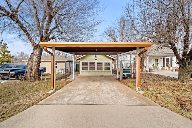 view of front of house with a carport and a sunroom