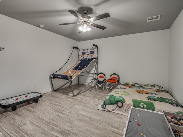 rec room featuring ceiling fan and wood-type flooring