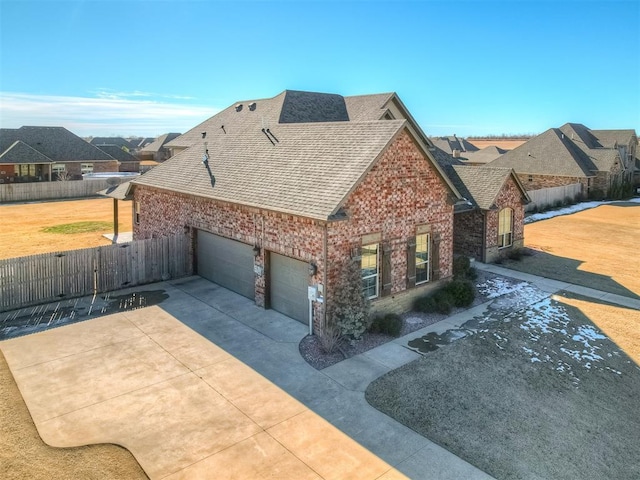 view of side of home featuring a garage