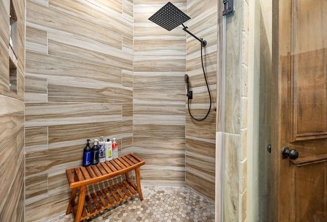 full bathroom with a tile shower