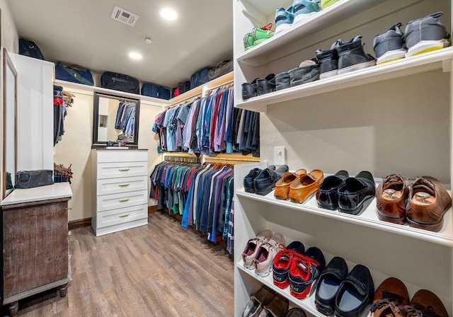 spacious closet featuring light wood-style floors and visible vents