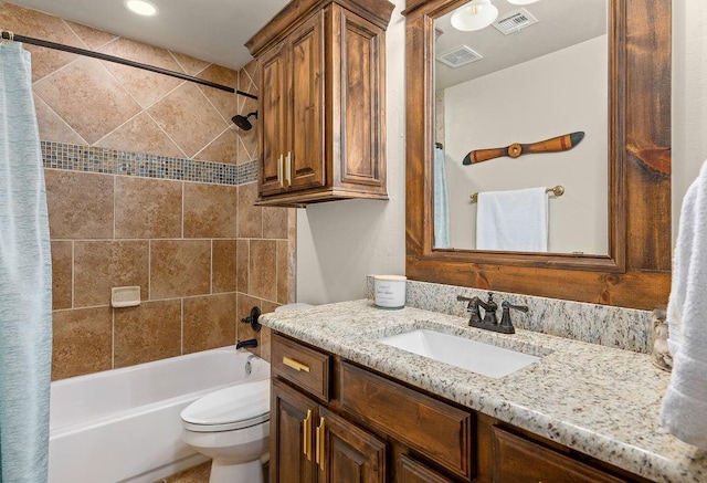 bathroom with vanity, toilet, shower / bath combo, and visible vents