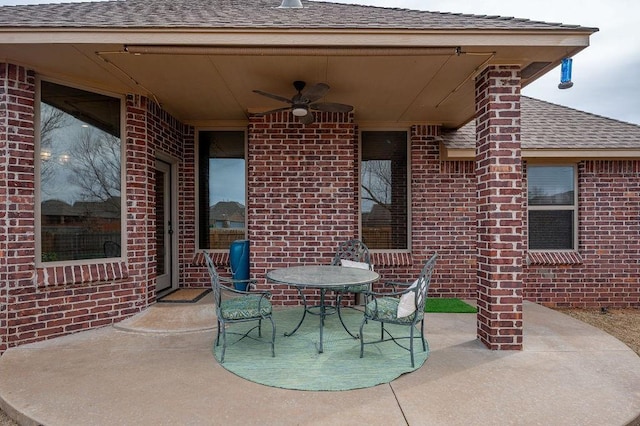 view of patio featuring ceiling fan and outdoor dining space