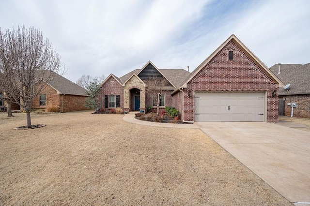 view of front facade featuring brick siding, concrete driveway, and an attached garage