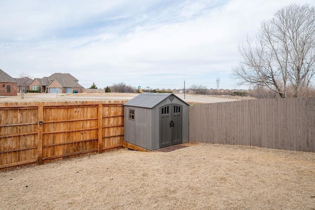 view of shed with a fenced backyard