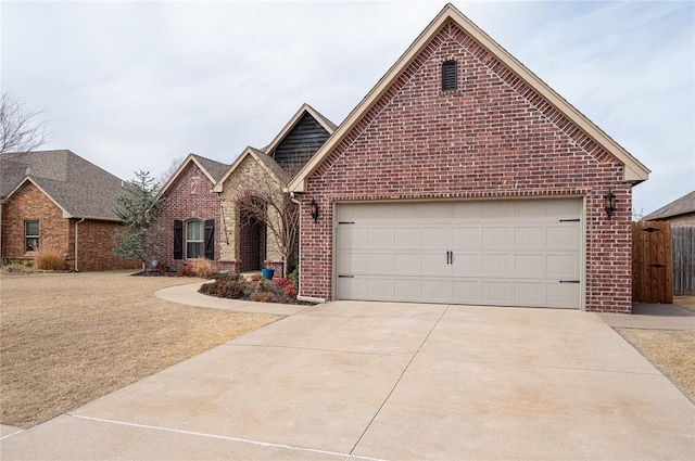 view of front of home with brick siding, concrete driveway, and an attached garage