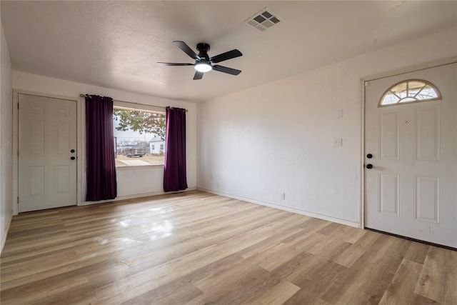 entrance foyer with ceiling fan and light hardwood / wood-style floors