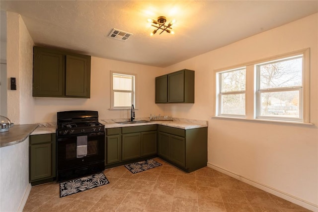 kitchen with sink and black gas range