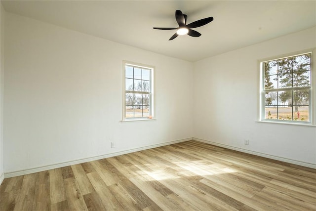 spare room featuring ceiling fan and light hardwood / wood-style flooring