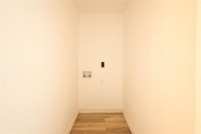 laundry room featuring washer hookup, light hardwood / wood-style flooring, and hookup for an electric dryer