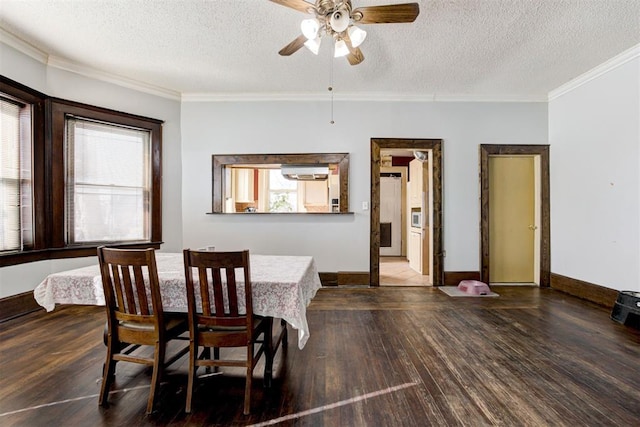 dining area with ceiling fan, crown molding, a textured ceiling, and hardwood / wood-style floors