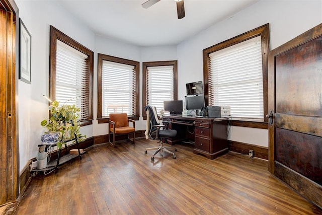 office with ceiling fan and dark wood-type flooring