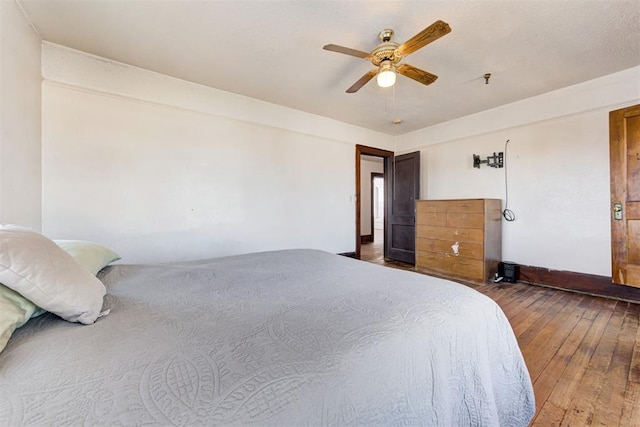 bedroom featuring ceiling fan and wood-type flooring