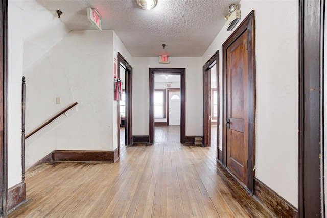 entrance foyer featuring a textured ceiling and hardwood / wood-style floors