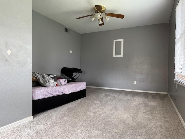 2601 S May Ave, Oklahoma City, OK 73108 - bedroom featuring carpet, baseboards, and a ceiling fan