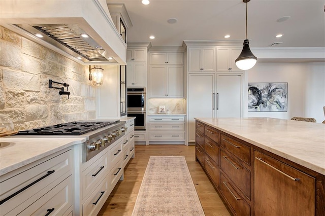 kitchen featuring white cabinetry, custom exhaust hood, and backsplash