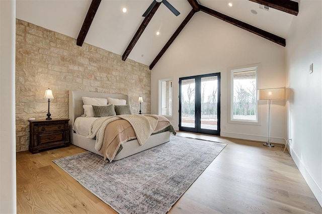 bedroom with french doors, access to outside, high vaulted ceiling, light hardwood / wood-style flooring, and beam ceiling