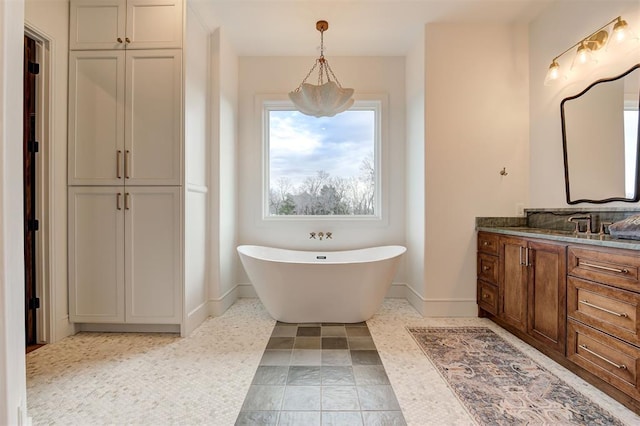 bathroom featuring a bath and vanity