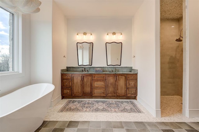 bathroom with vanity and separate shower and tub