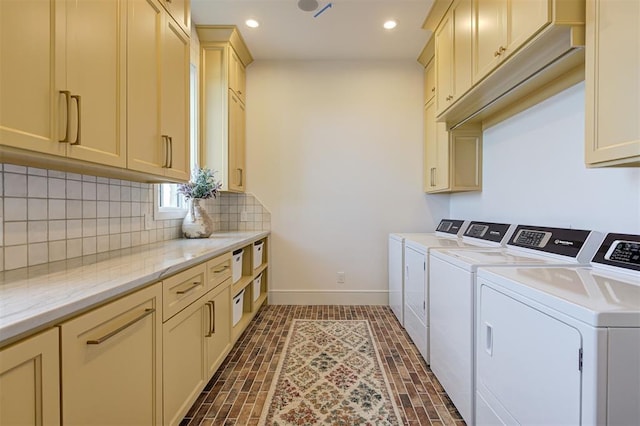 laundry area with cabinets and washer and dryer