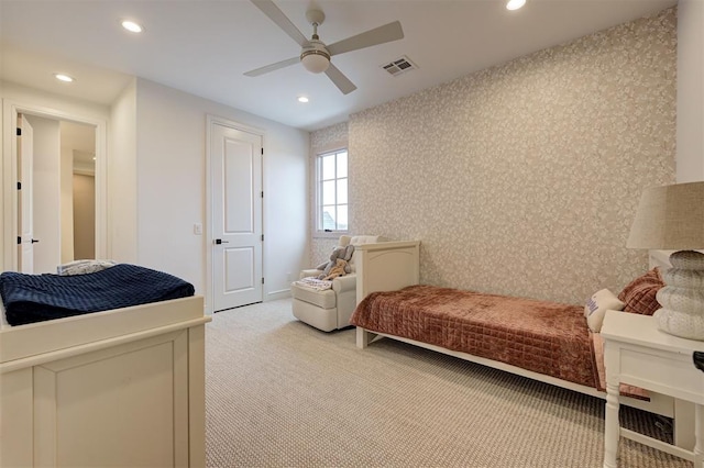 carpeted bedroom featuring ceiling fan