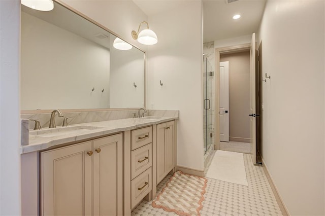 bathroom with an enclosed shower and vanity