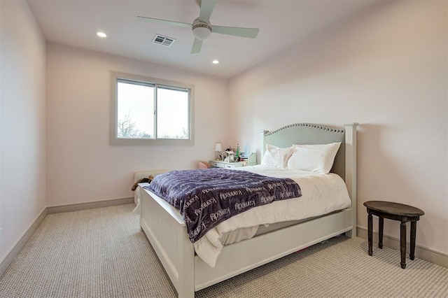 bedroom featuring ceiling fan and light carpet