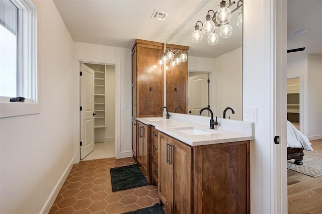 bathroom with vanity and tile patterned flooring