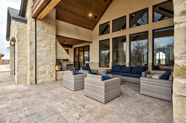 view of patio / terrace featuring an outdoor living space with a fireplace