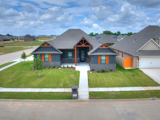 1801 Taines Turn, Norman, OK 73072 - view of front of house featuring a garage, brick siding, fence, concrete driveway, and a front lawn