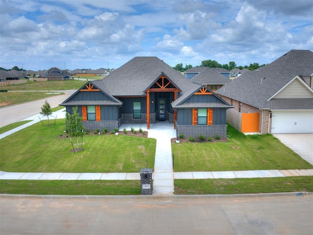 view of front of house featuring a garage, brick siding, fence, concrete driveway, and a front lawn