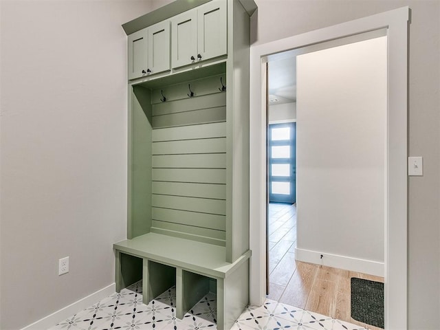 mudroom featuring light wood-style floors and baseboards