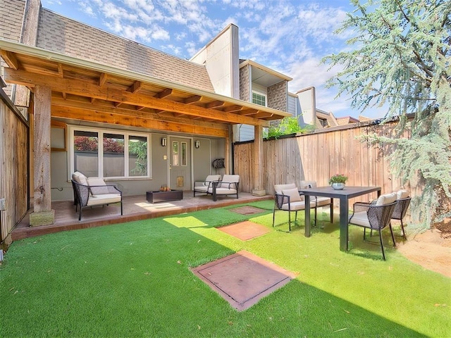 back of house featuring a patio, a lawn, and outdoor lounge area