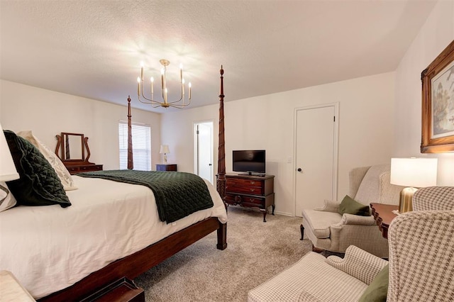 carpeted bedroom featuring an inviting chandelier