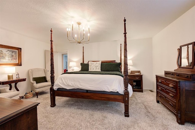 carpeted bedroom featuring a textured ceiling and a notable chandelier