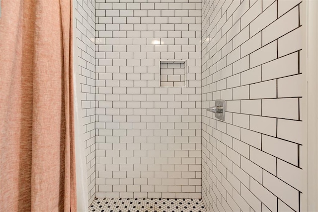 interior space with tiled shower