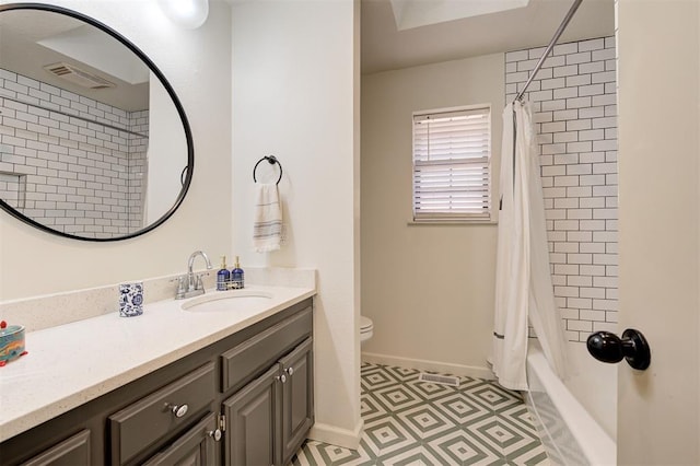 full bathroom featuring toilet, shower / bath combo, and vanity