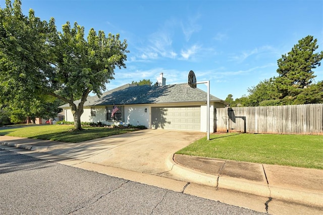 single story home with a garage and a front yard