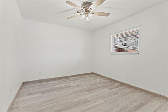 empty room with light hardwood / wood-style floors and ceiling fan