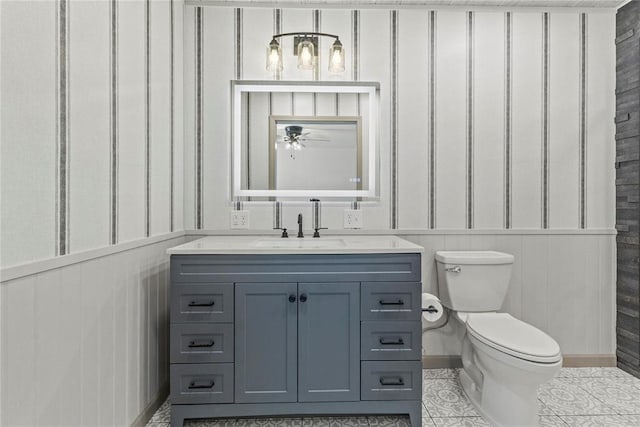 bathroom with vanity, toilet, and tile patterned flooring