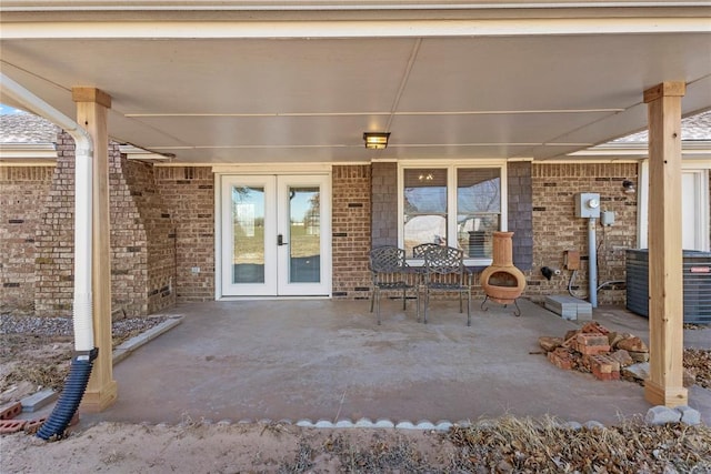 view of patio / terrace with central AC unit and french doors