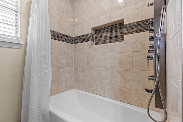 bathroom featuring shower / bathtub combination with curtain