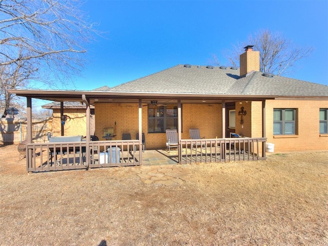 back of property featuring a patio area