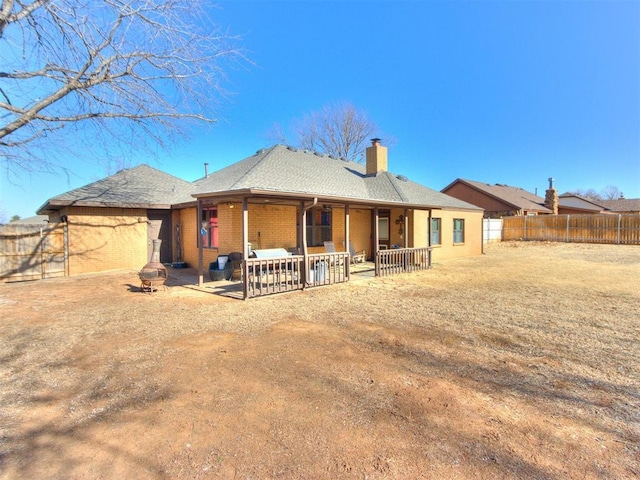 back of property with a patio