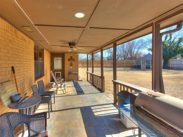 view of patio / terrace with ceiling fan and area for grilling