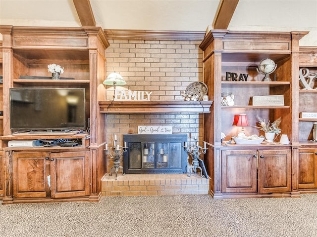 living room featuring light colored carpet, beamed ceiling, and a fireplace