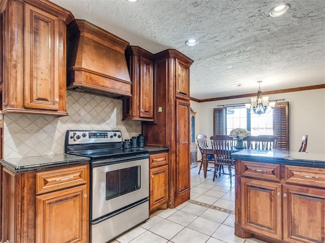 kitchen with premium range hood, ornamental molding, a chandelier, stainless steel range with electric stovetop, and light tile patterned floors