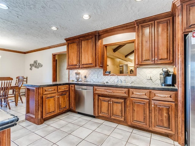 kitchen featuring appliances with stainless steel finishes, tasteful backsplash, sink, kitchen peninsula, and light tile patterned floors