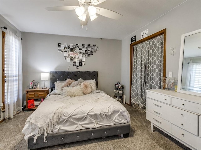 bedroom with dark colored carpet and ceiling fan